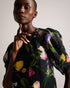 PHOEBIA-Tops-Make a statement with this beautiful and feminine boxy top. PHOEBIA's scattered bouquet floral print, short puff sleeves, and oversized self-tie back create an eye-catching silhouette. Crafted from textured fabric with a crew neck, it's perfect for a day out or a special occasion.The fabric of this product is made with 100% recycled polyester. Using recycled polyester helps divert plastic waste from ending in landfills, and helps us to reduce our dependence on virgin materials. Boxy top Scatter